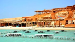 Beach and wooden shaded seating at Orange Bay, Hurghada