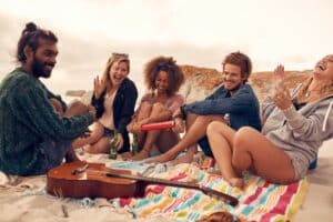 Friends enjoying at beach party