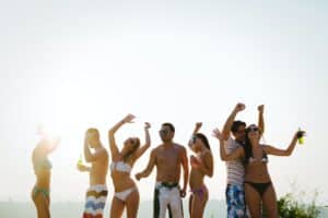 Friends partying during summer sunset