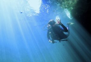 Girl descending while scuba diving