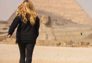 Running girl. Travel in Egypt. Pyramids of Giza.