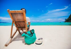 Young man on the white beach on vacation