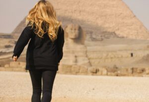 Running girl. Travel in Egypt. Pyramids of Giza.