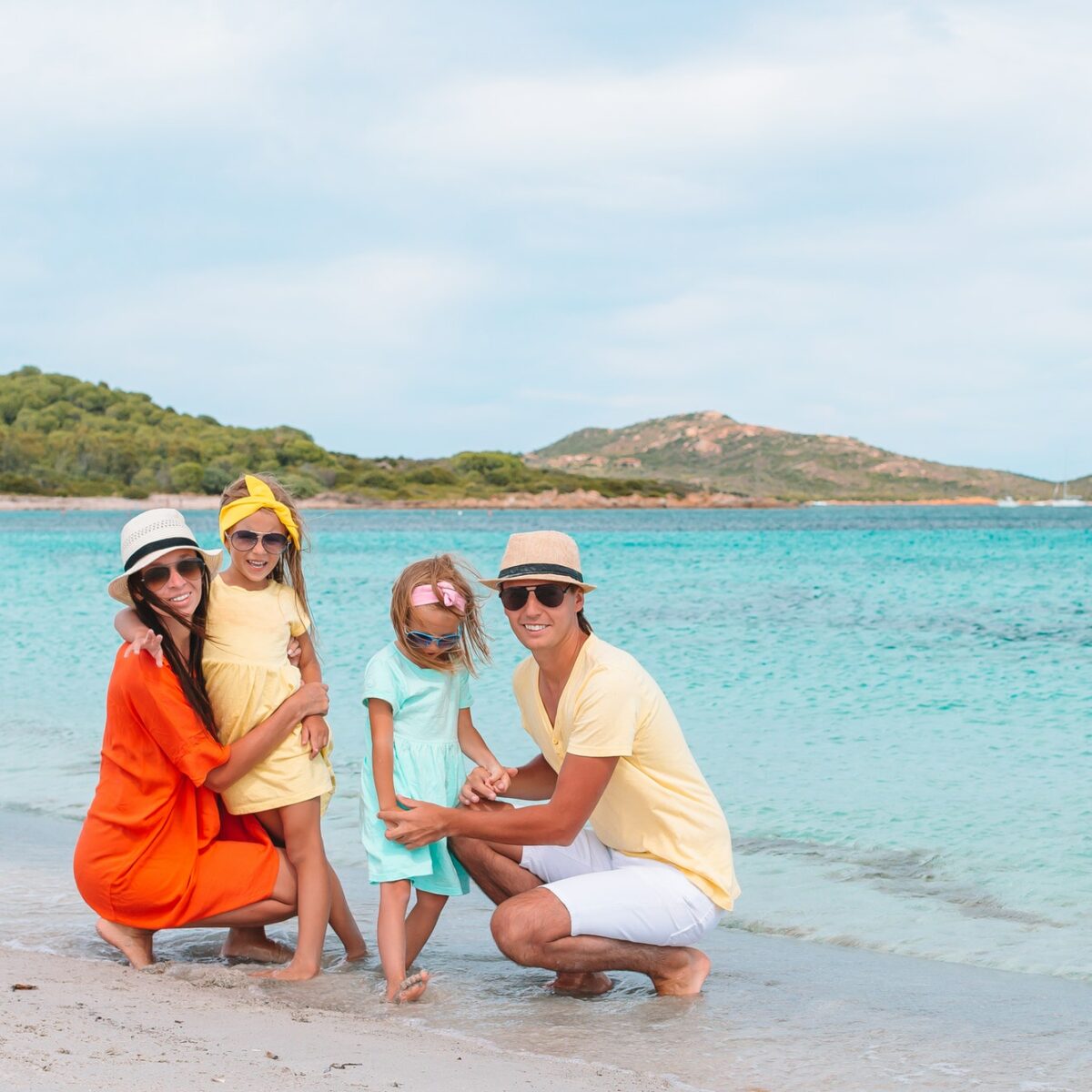 Happy family on the beach during summer vacation